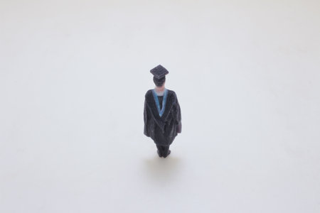 a Figure of a Graduate in Academic Cap and Gownの写真素材
