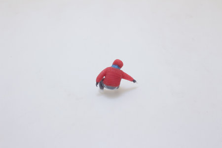 Image of a miniature figure wearing a red and blue outfitの写真素材