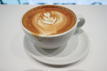 Dec 5 2024 A beautifully crafted latte with intricate foam art served