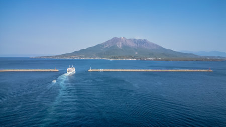 March 23 2025 stunning coastal scene featuring a mountain, clear blue sea, and a serene skyの写真素材