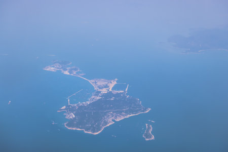 A peaceful aerial shot showcasing an island surroundedの写真素材