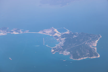 A peaceful aerial shot showcasing an island surroundedの写真素材