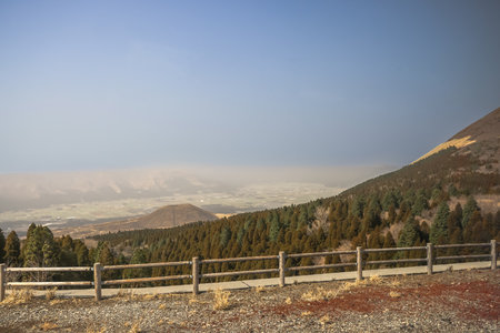 A scenic view of a rural landscape with a wooden fence iの写真素材