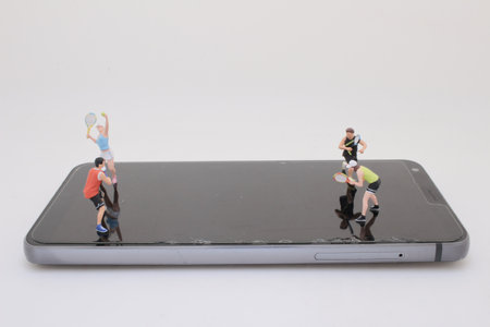 unique composition of tiny tennis players set on a smartphone screen