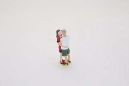 A detailed miniature scene showing two figures in an affectionate embraceの写真素材