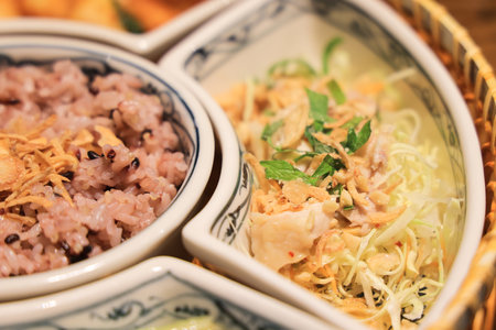 a traditional dish featuring rice and a fresh vegetable medley