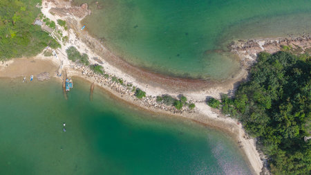 beautiful peninsula surrounded by clear blue watersの写真素材