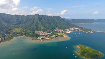 A scenic aerial photo of a serene coastal village surroundedの写真素材