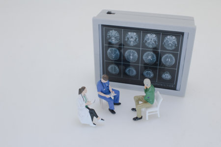 Professionally dressed miniature figures of medical professionals examiningの写真素材