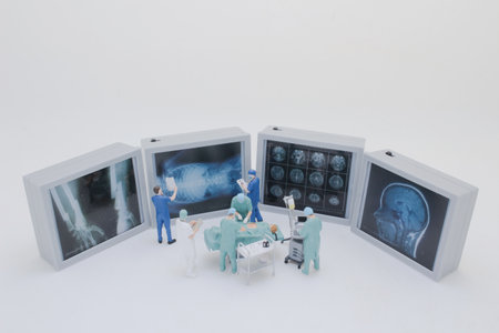 Professionally dressed miniature figures of medical professionals examining