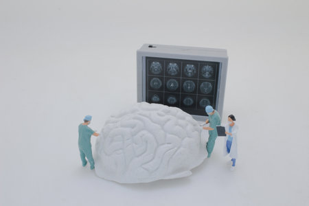 Professionally dressed miniature figures of medical professionals examining