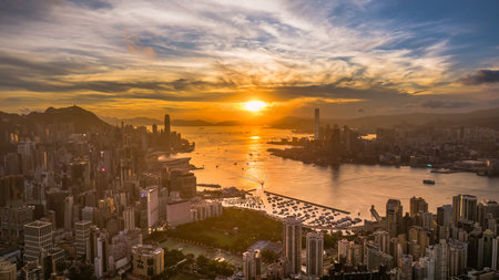 a Sunset Reflections Across Victoria Harbour Skiesの写真素材