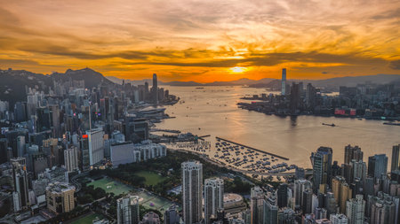 A Sunset Silhouettes Crown Kowloon Urban Majestyの写真素材