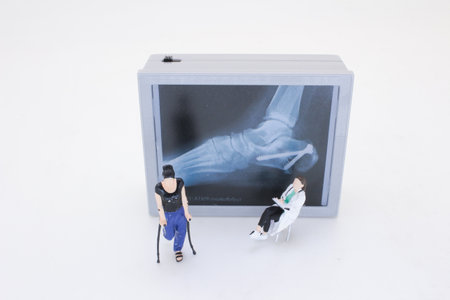 A miniature scene featuring a figure with crutches consulting