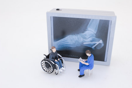 A miniature scene featuring a figure with crutches consultingの写真素材