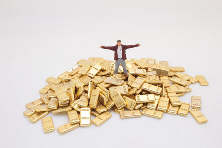 representing a person stands on a large pile of gold barの写真素材
