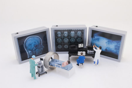 Depicts intricate miniature figures of medical professionals using MRIの写真素材