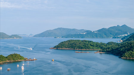 A tranquil coastal panorama showcasing calm waters, numerous boats,の写真素材
