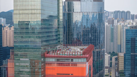 Dynamic city landscape with towering glass skyscrapers and urban skylineの写真素材