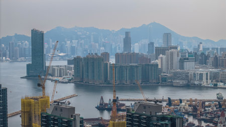 cityscape featuring dense urban buildings, harbor filled with boatsの写真素材