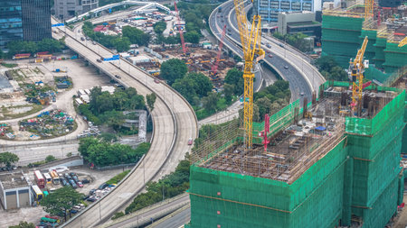 view showcasing skyscrapers, construction cranes, and urban developmentの写真素材