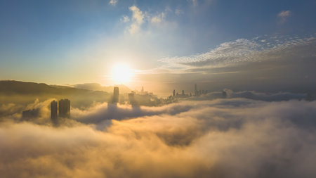 March 2 2025 serene view of a cityscape at dawn, surrounded by clouds