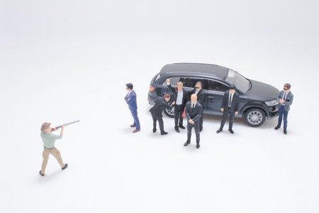 Miniature figures arranged in a creative scene including individuals
