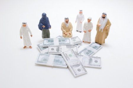Miniature figures dressed in traditional attire are standing around pilesの写真素材