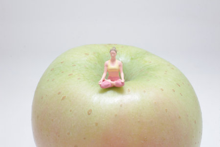 A creative depiction of a tiny figure performing yogaの写真素材