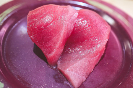 Appetizing close-up of fresh sashimi pieces with a glazed aの写真素材
