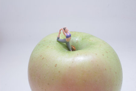 A creative depiction of a tiny figure performing yogaの写真素材