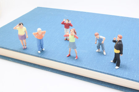 A collection of small plastic figures arranged on the coverの写真素材