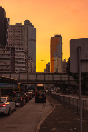 Evening cityscape with traffic and glowing skylineの素材