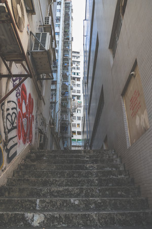 Hidden alley with neon lights and urban texturesの素材