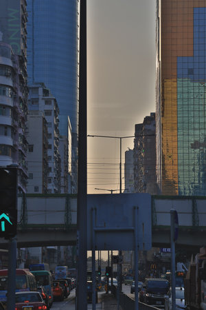 Evening cityscape with traffic and glowing skylineの素材