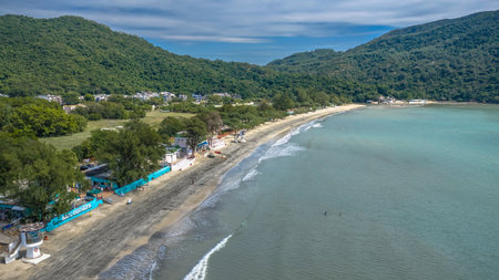 Scenic beach landscape with mountains in Pui Oのeditorial素材