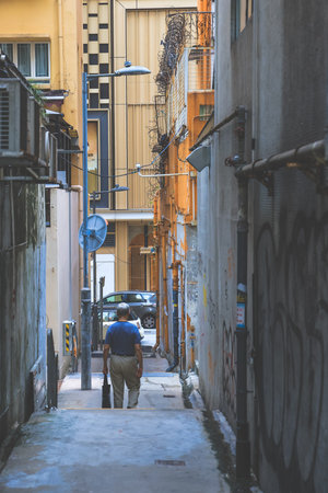 Hidden alley with neon lights and urban texturesのeditorial素材