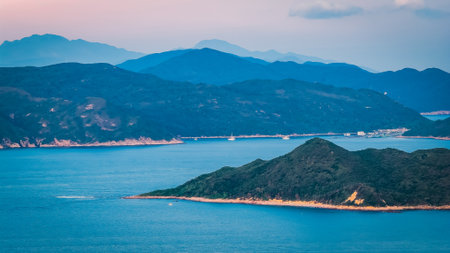 Peaceful bay with boats and islands in Hong Kongの写真素材