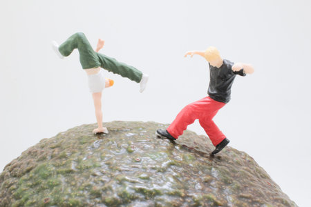 Two small toy figures strike dynamic poses onの写真素材