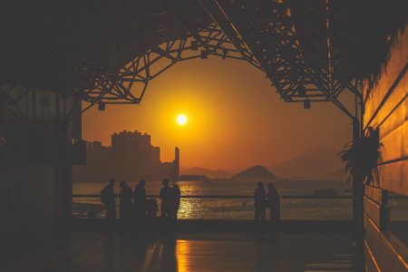 amber toned interior shows visitors seated along a corridor, Tsim Sha Tsui Nov 16 2025のeditorial素材