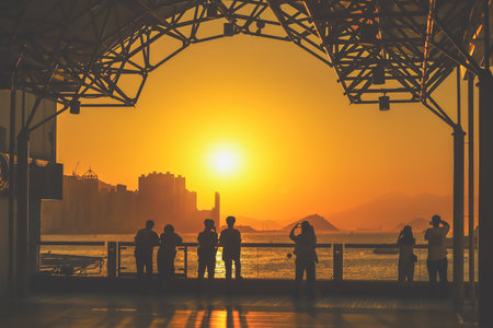 amber toned interior shows visitors seated along a corridor, Tsim Sha Tsui Nov 16 2025のeditorial素材