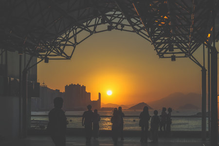amber toned interior shows visitors seated along a corridor, Tsim Sha Tsui Nov 16 2025のeditorial素材
