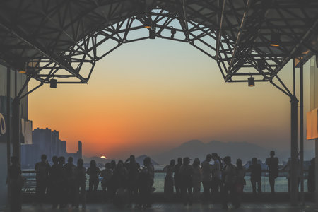 amber toned interior shows visitors seated along a corridor, Tsim Sha Tsui Nov 16 2025のeditorial素材