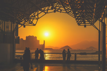 amber toned interior shows visitors seated along a corridor, Tsim Sha Tsui Nov 16 2025のeditorial素材
