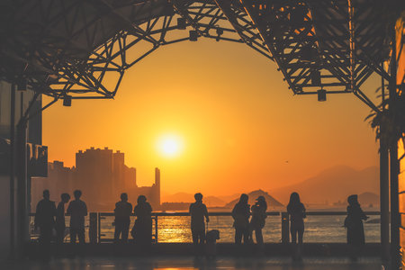 amber toned interior shows visitors seated along a corridor, Tsim Sha Tsui Nov 16 2025のeditorial素材