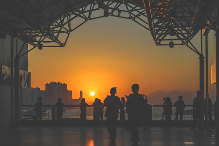 amber toned interior shows visitors seated along a corridor, Tsim Sha Tsui Nov 16 2025のeditorial素材