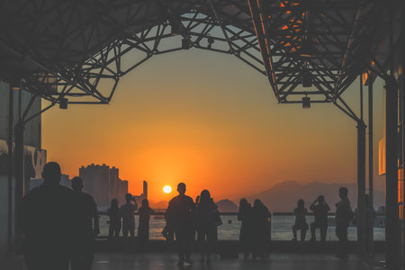 amber toned interior shows visitors seated along a corridor, Tsim Sha Tsui Nov 16 2025のeditorial素材