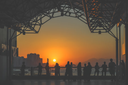 amber toned interior shows visitors seated along a corridor, Tsim Sha Tsui Nov 16 2025のeditorial素材