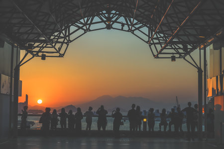 amber toned interior shows visitors seated along a corridor, Tsim Sha Tsui Nov 16 2025のeditorial素材