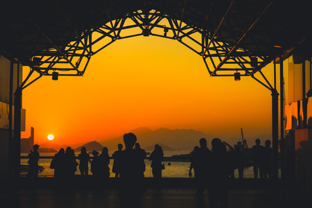 amber toned interior shows visitors seated along a corridor, Tsim Sha Tsui Nov 16 2025のeditorial素材